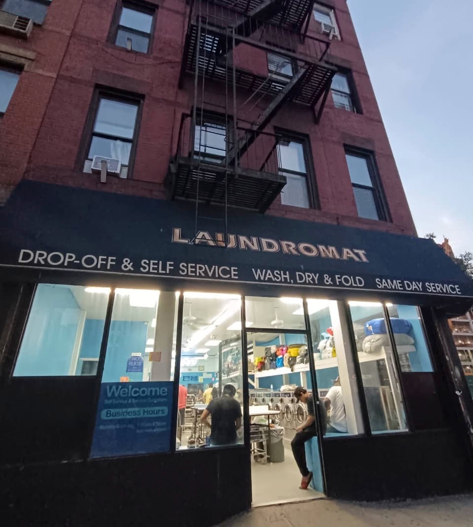 Hell's Kitchen Laundromat storefront at 703 10th Ave (at 500 W 48th St)